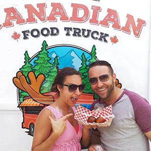 Couple eating from food truck